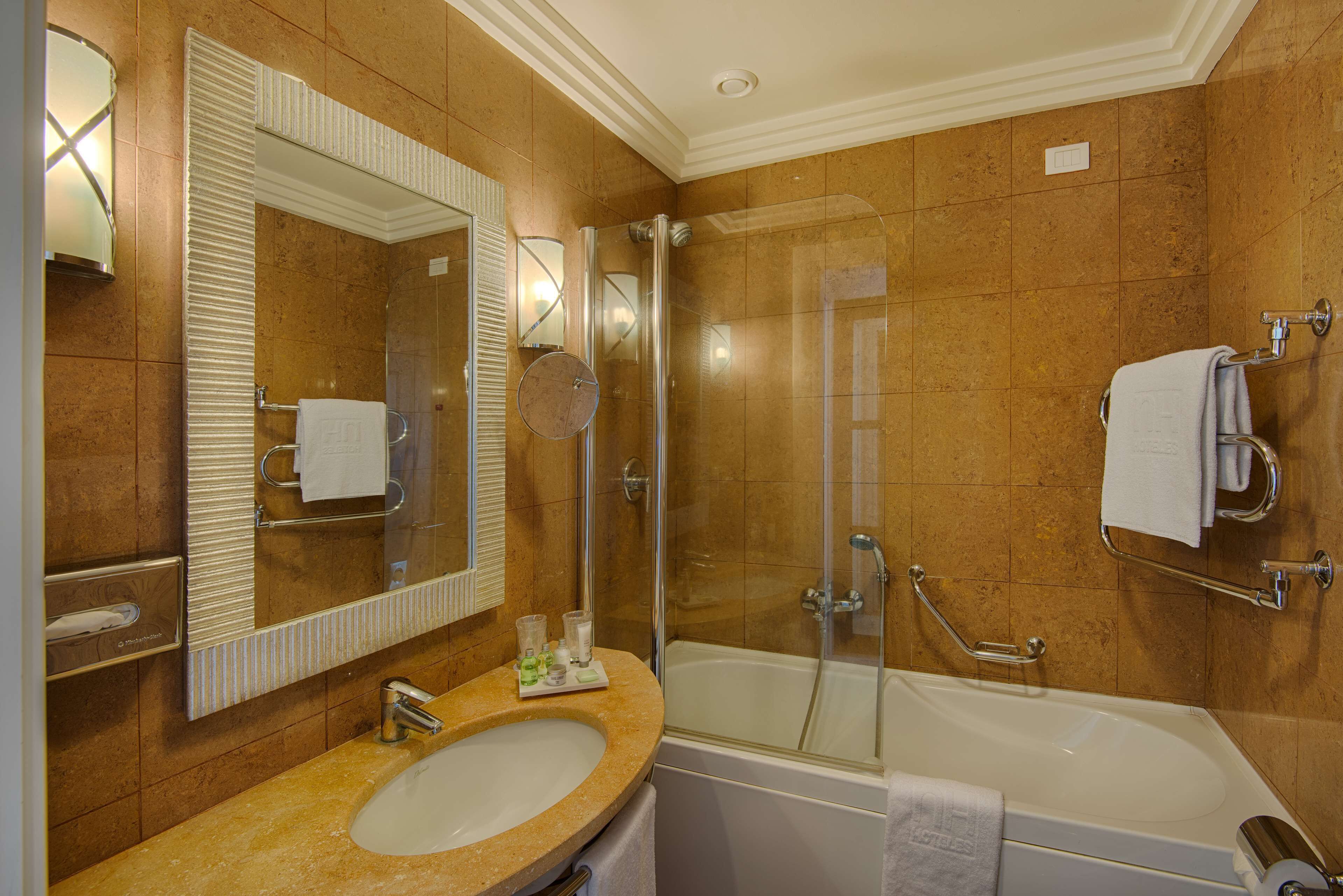 deep-soaking bathtub, rainfall showerhead, eco-friendly toiletries