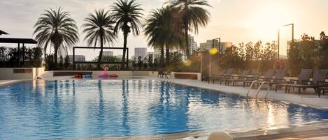 Outdoor pool, open 7:00 AM to 10:00 PM, free pool cabanas, pool loungers