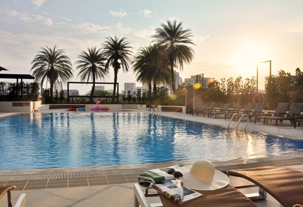 Outdoor pool, open 7:00 AM to 10:00 PM, free cabanas, sun loungers