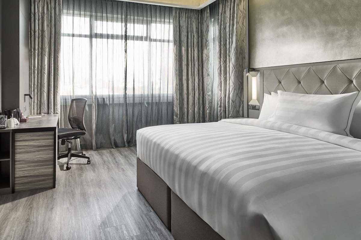 Deluxe Room with 1 King Bed | Minibar, in-room safe, individually furnished, desk