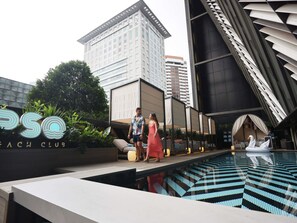 Outdoor pool, open 6:00 AM to 10:00 PM, free pool cabanas