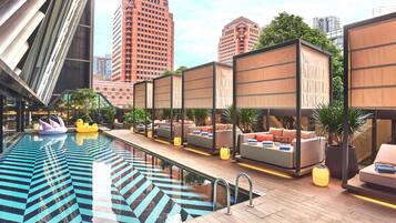 Outdoor pool, open 6:00 AM to 10:00 PM, free pool cabanas