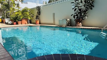 Outdoor pool, open 7:00 AM to 7:30 PM, pool loungers