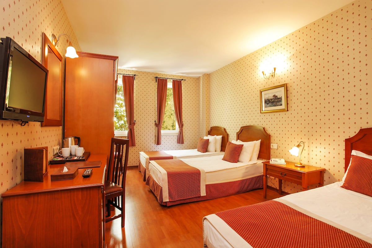 Triple room | Premium bedding, minibar, in-room safe, desk