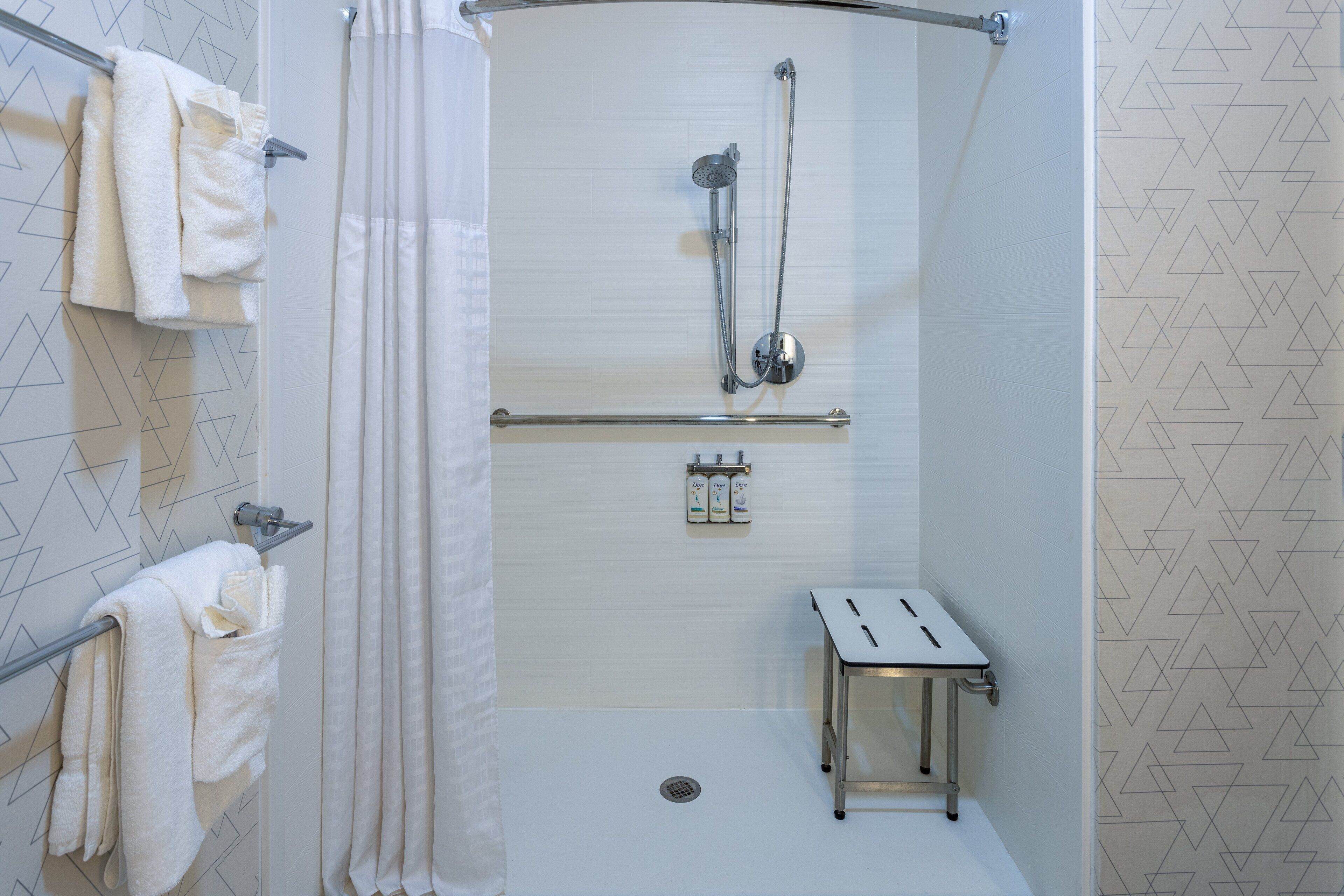 combined shower/bathtub, hair dryer, towels, soap
