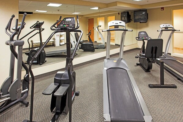 A fitness center with treadmills, elliptical machines, and stationary bikes. - Holiday Inn Express Hotel & Suites Boston-Marlboro by IHG (Hudson)