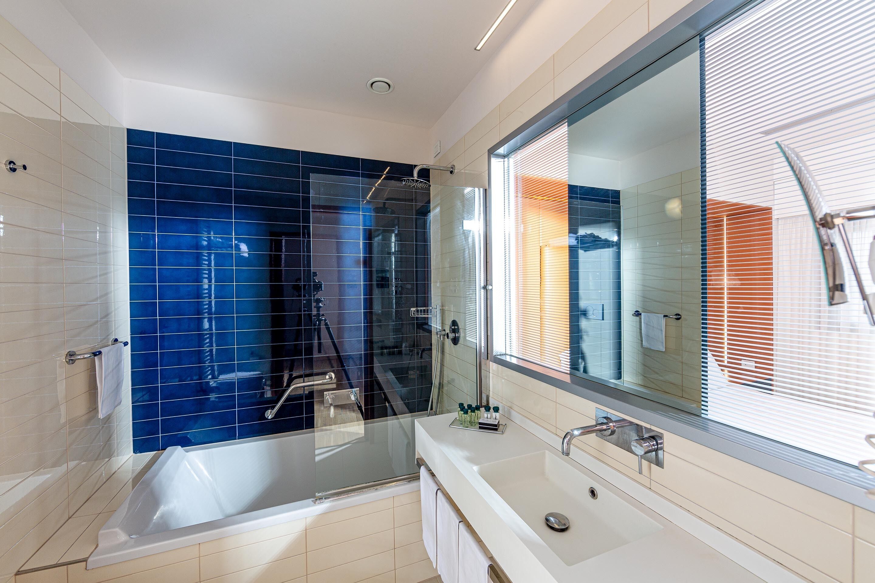 junior quadruple room | bathroom | hair dryer, slippers, bidet, towels