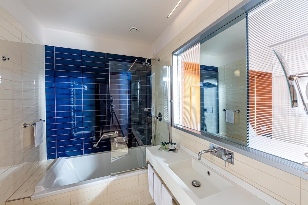 junior quadruple room | bathroom | hair dryer, slippers, bidet, towels