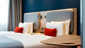A hotel room with a large bed, two bedside tables, and a wooden headboard. - Holiday Inn Express Strathclyde Park M74 JCT 5 by IHG (Glasgow)