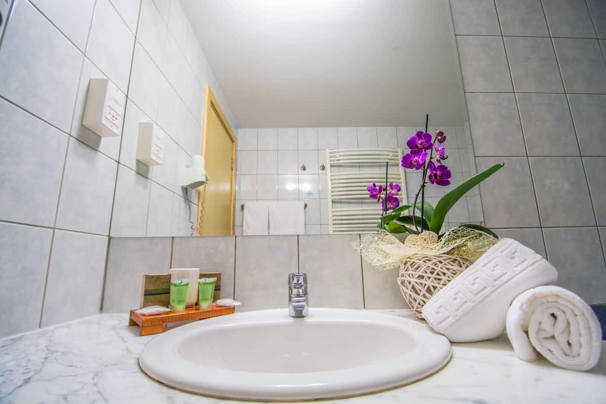 deep-soaking bathtub, free toiletries, hair dryer, bathrobes