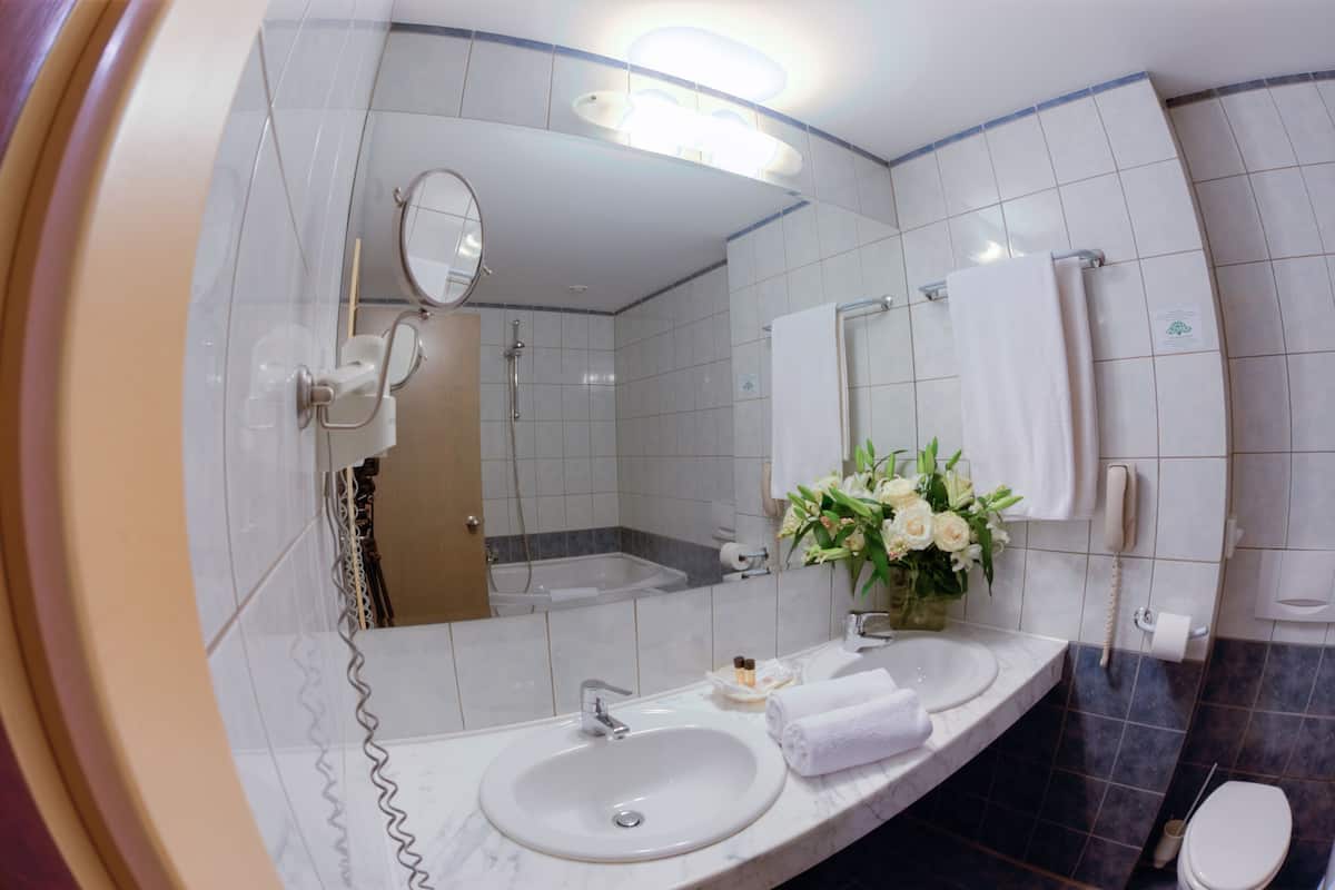 deep-soaking bathtub, free toiletries, hair dryer, bathrobes