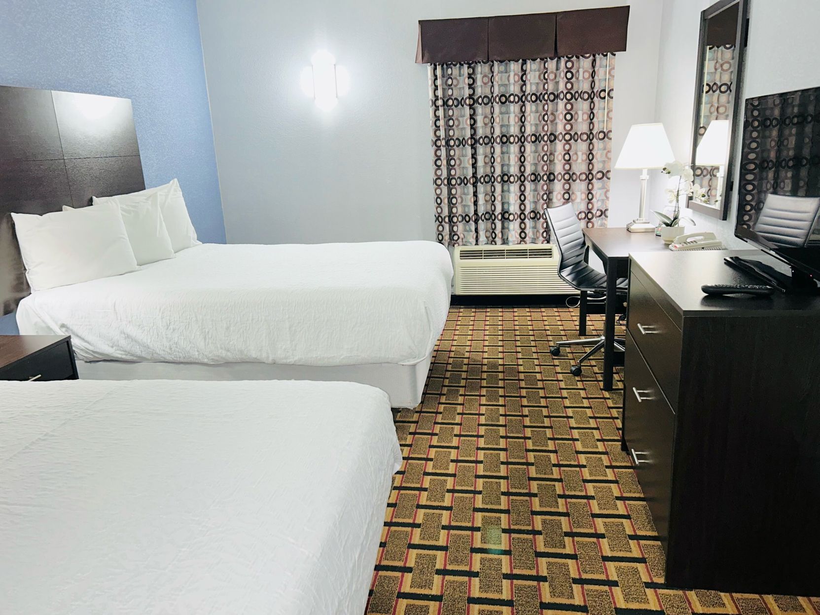 Premium bedding, down comforters, pillowtop beds, desk