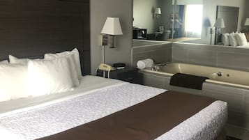 Suite, 1 King Bed, Jetted Tub | Desk, iron/ironing board, free cots/infant beds, rollaway beds
