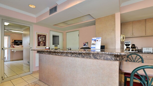 A kitchen with a marble countertop, a coffee maker, and a toaster. - Anthony Inn (Anthony)