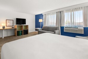 Room, 1 King Bed with Sofa bed | Living area | 32-inch LCD TV with cable channels, TV