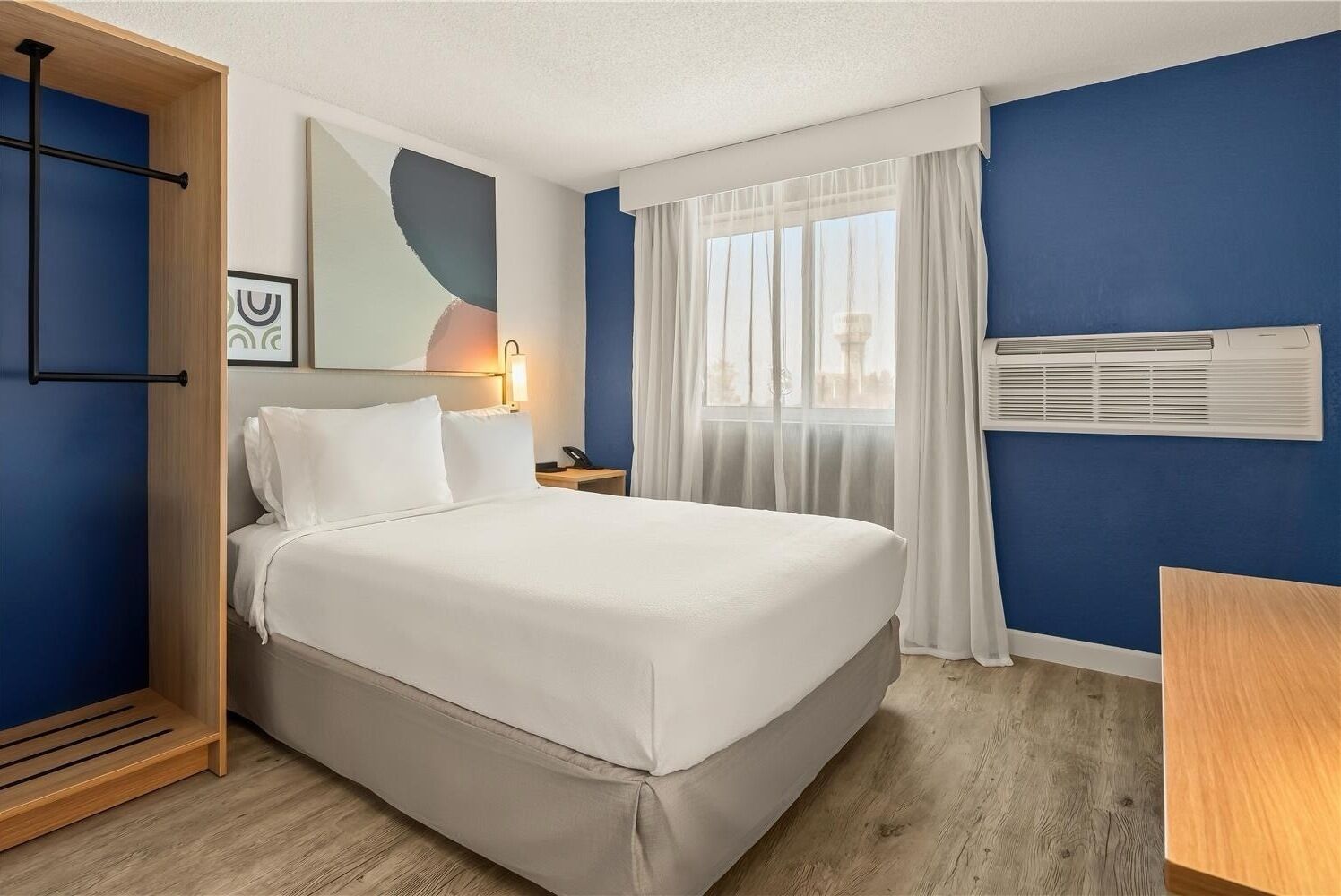 Room, 1 Queen Bed | Laptop workspace, blackout curtains, iron/ironing board