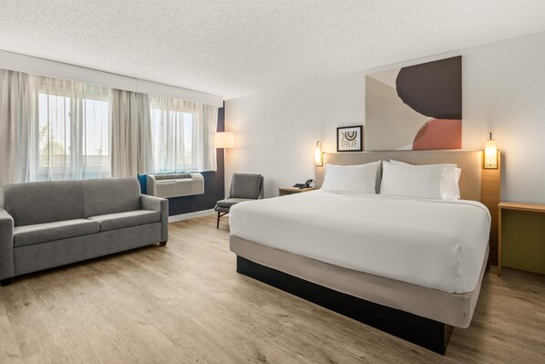 Room, 1 King Bed with Sofa bed | Living area | 32-inch LCD TV with cable channels, TV