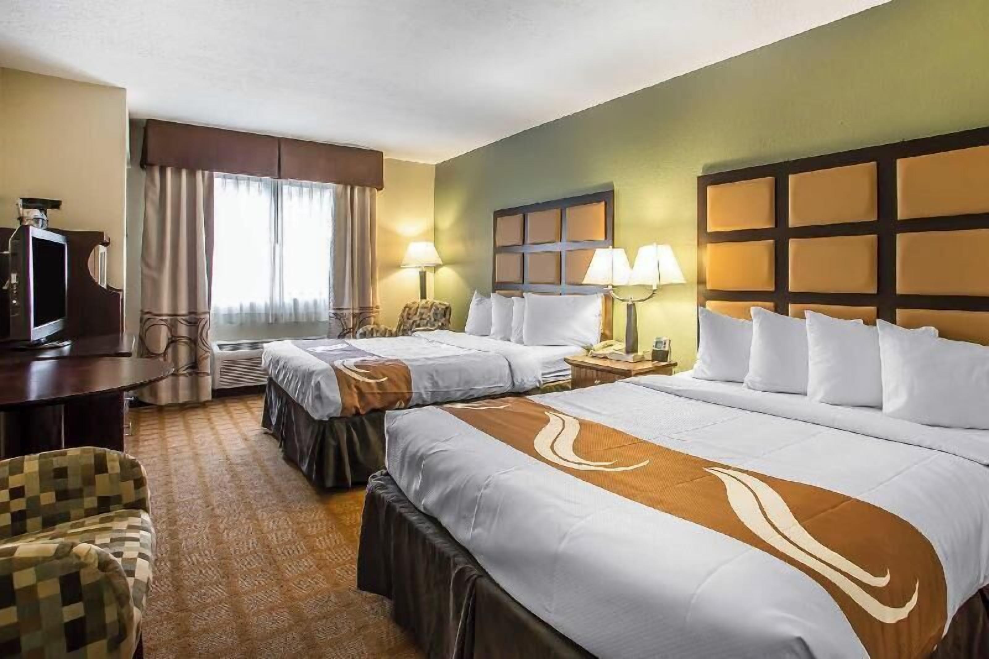 Pillowtop beds, desk, laptop workspace, blackout drapes