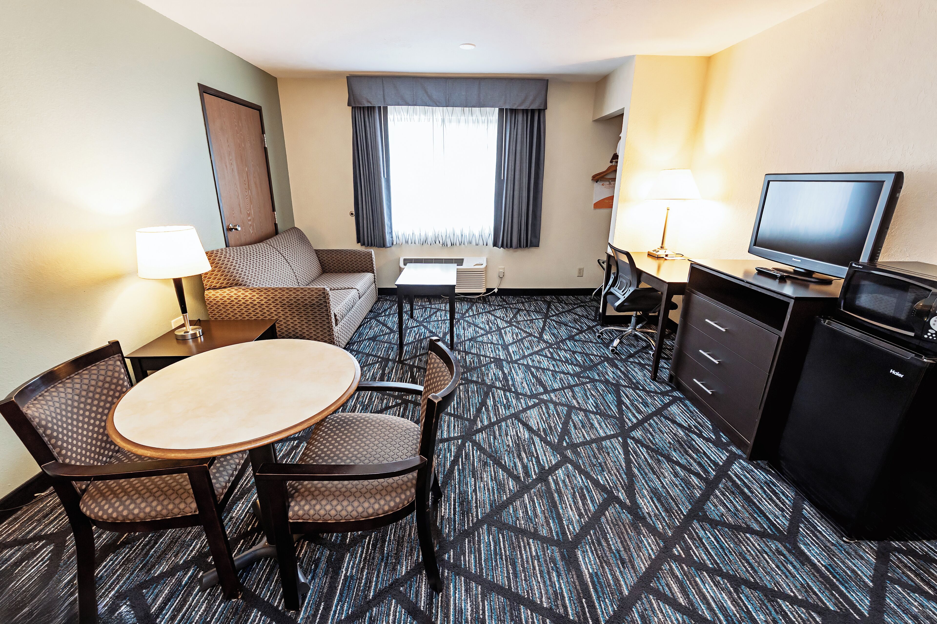 Suite, 1 King Bed with Sofa bed, Non Smoking (Parking View) | Living area | 32-inch LCD TV with cable channels, TV