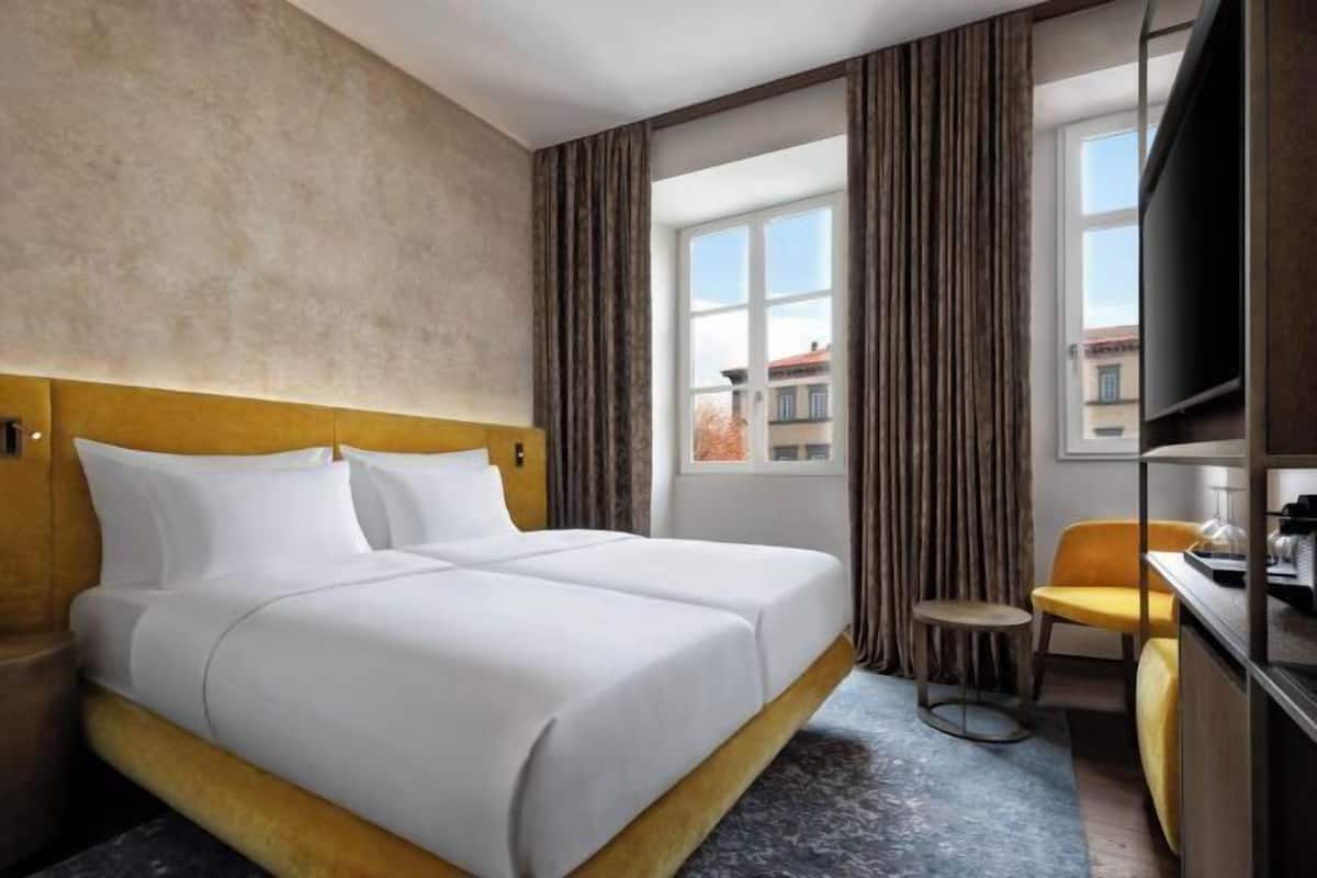 Ropa de cama de alta calidad, minibar, caja fuerte y wifi gratis