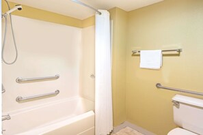 A bathroom with a bathtub, a shower, and a toilet.