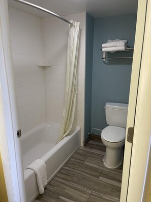 Room, 2 Double Beds, Non Smoking | Bathroom | Combined shower/tub, hair dryer, towels