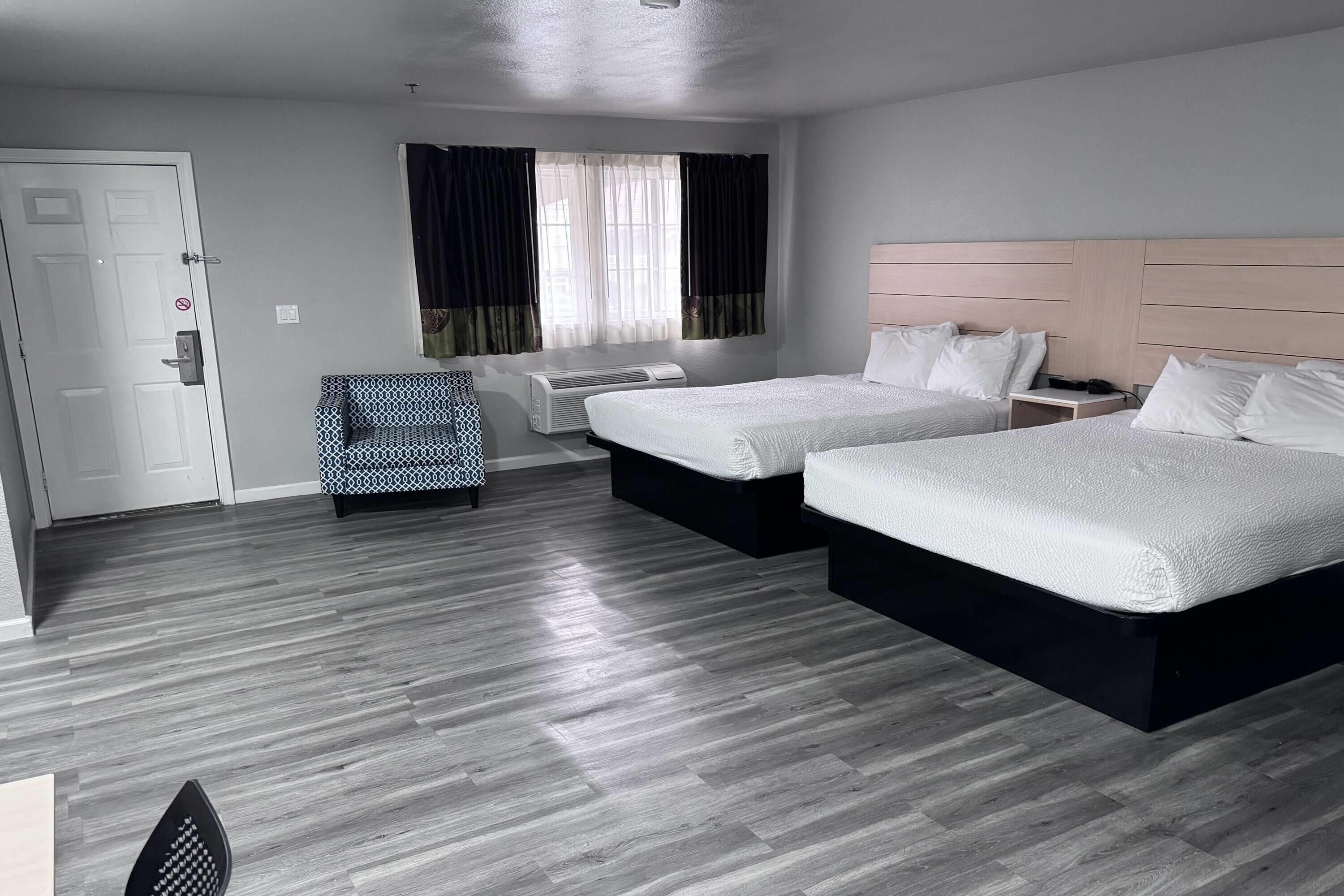 Room, 2 Queen Beds, Non Smoking, Kitchenette | Iron/ironing board, free WiFi, bed sheets