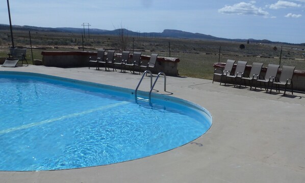 Seasonal outdoor pool, open 9:00 AM to 8:00 PM, sun loungers