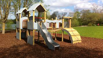 Children can play and climb on the slide and climbing areas in this park.