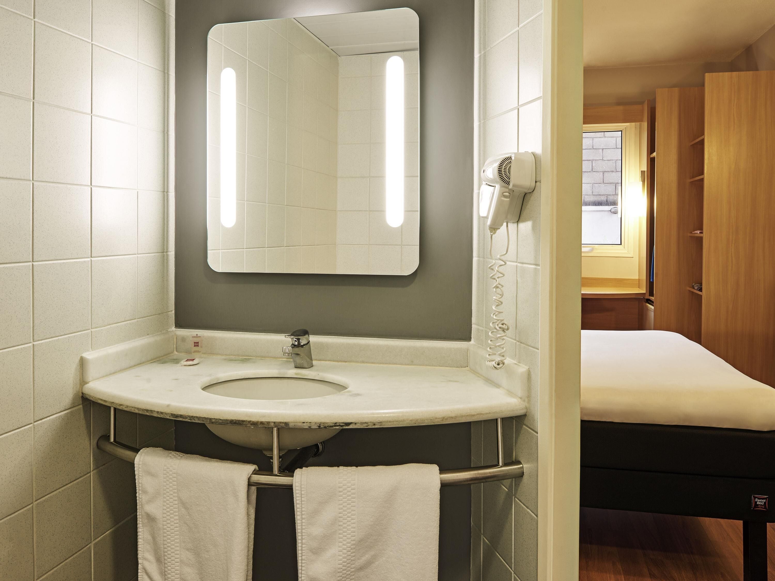 Shower, eco-friendly toiletries, hair dryer, towels