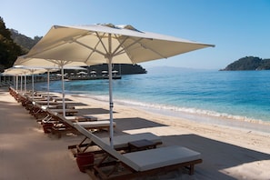 Private beach, free beach shuttle, sun loungers, beach umbrellas