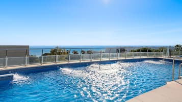 Indoor pool, 3 outdoor pools, open 9 AM to 9 PM, pool umbrellas
