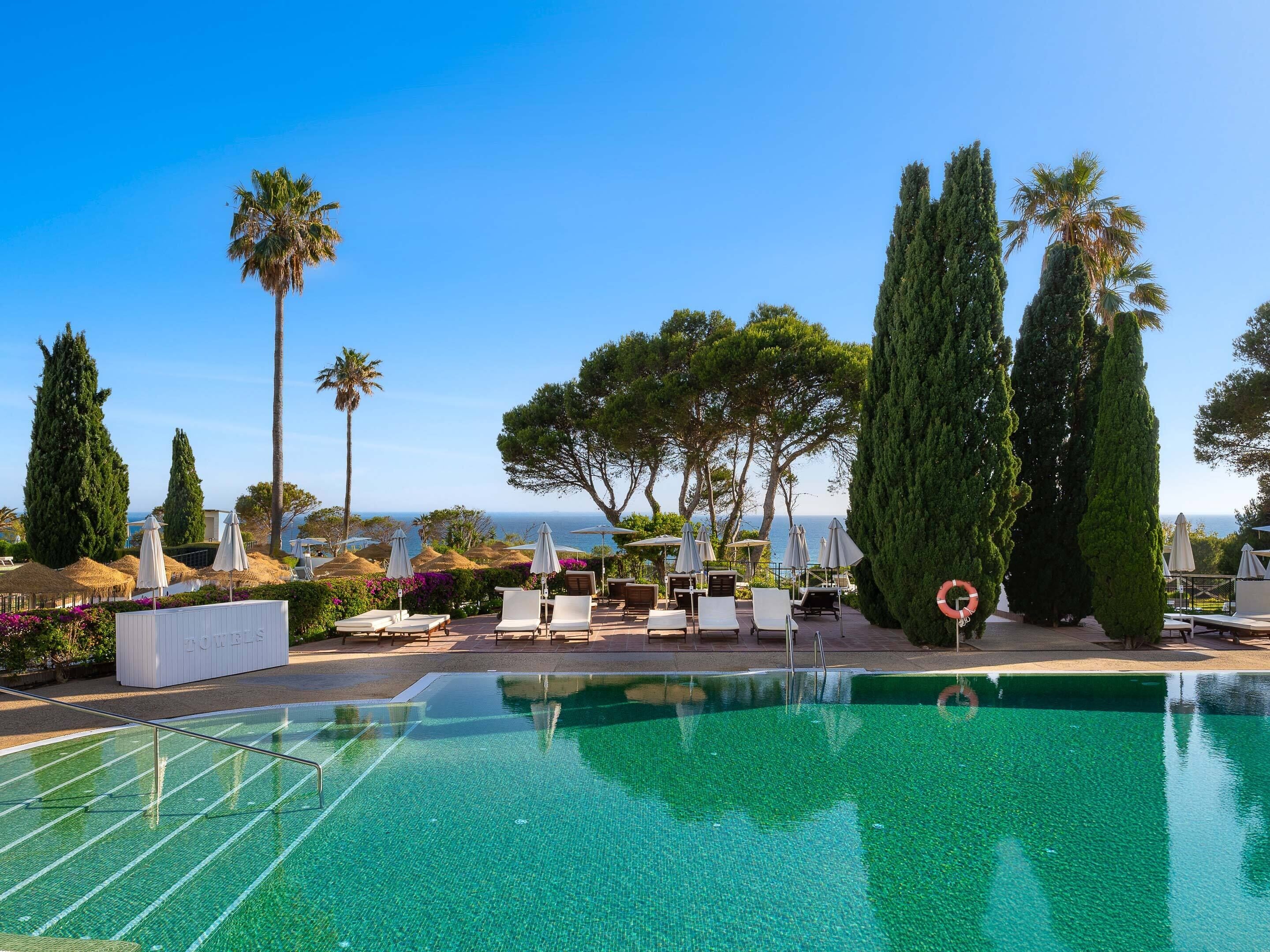 Indoor pool, 3 outdoor pools, open 9 AM to 9 PM, pool umbrellas