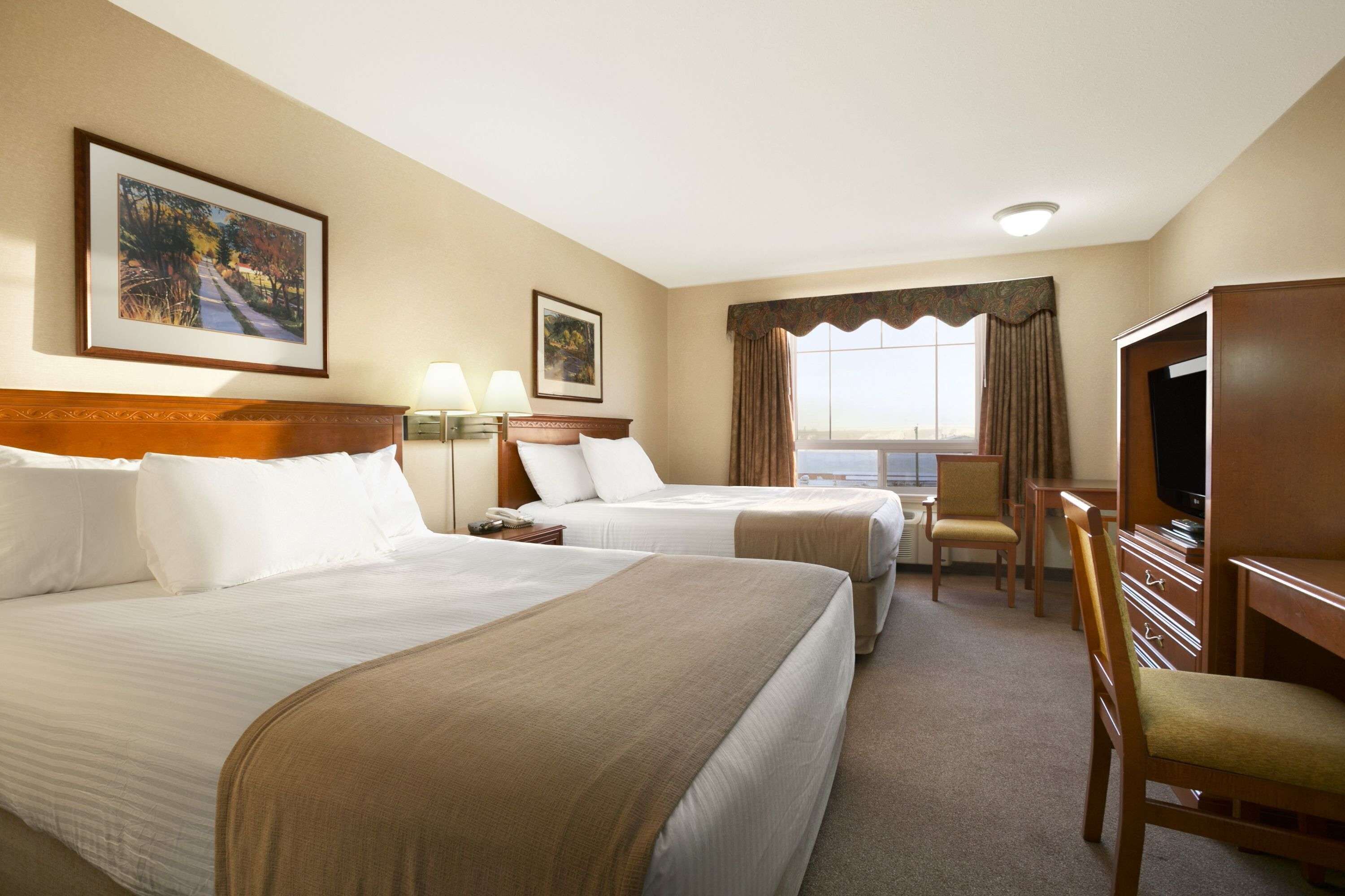 Desk, blackout drapes, iron/ironing board, free cribs/infant beds