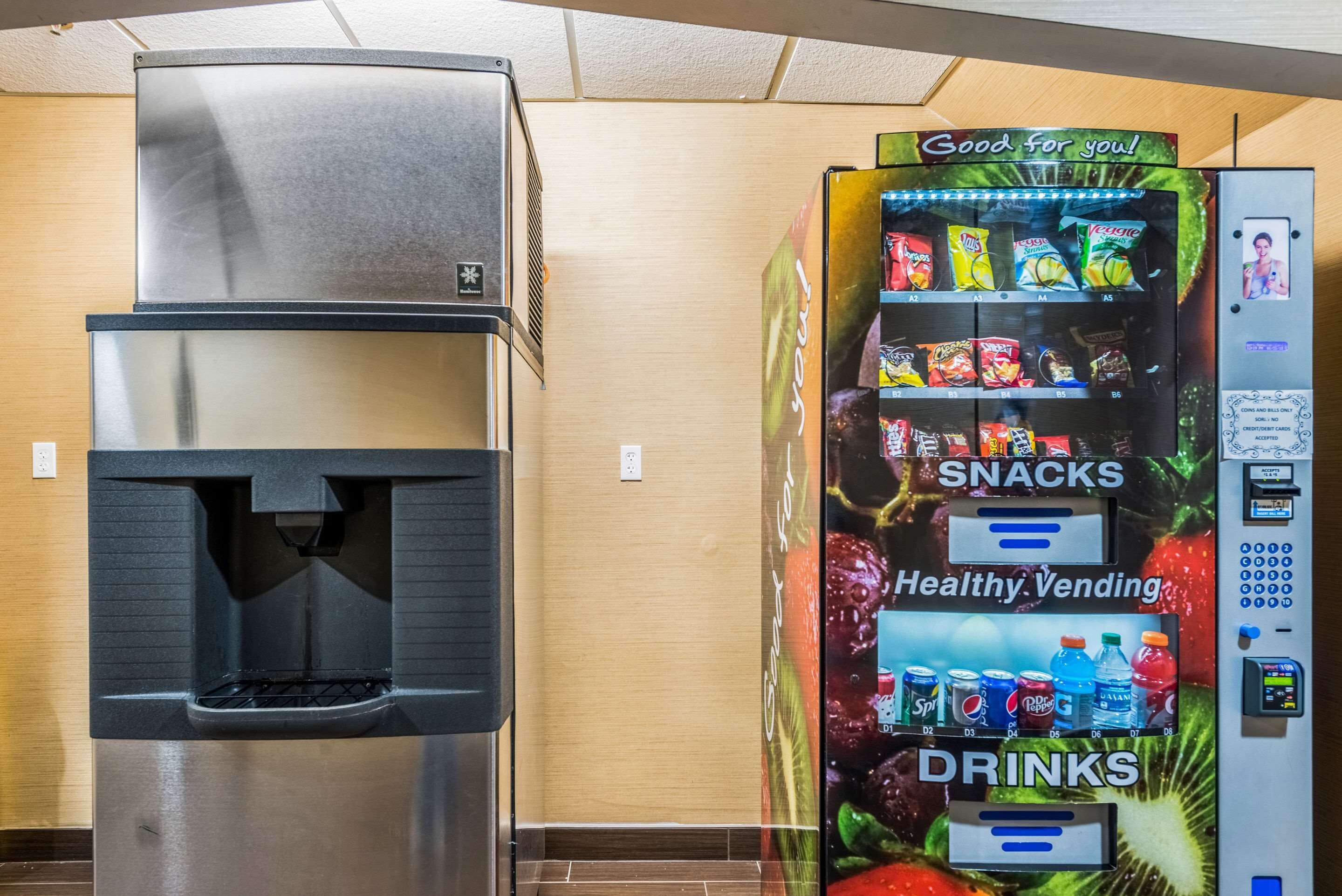 A vending machine with snacks and drinks, and a water dispenser.