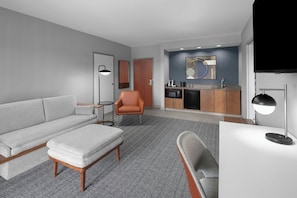 Suite, 1 King Bed with Sofa bed | Living area | 32-inch Smart TV with cable channels, TV, Netflix