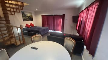 Family Suite, 2 Bedrooms | Living area | 32-inch LED TV with satellite channels, TV