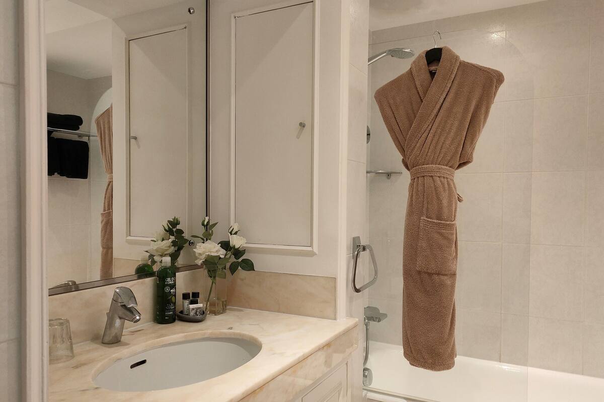 comfort room, city view | bathroom | bathtub, free toiletries, hair dryer, bathrobes