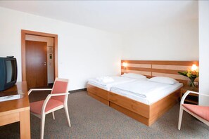 Standard Double Room | Minibar, in-room safe, blackout drapes, iron/ironing board