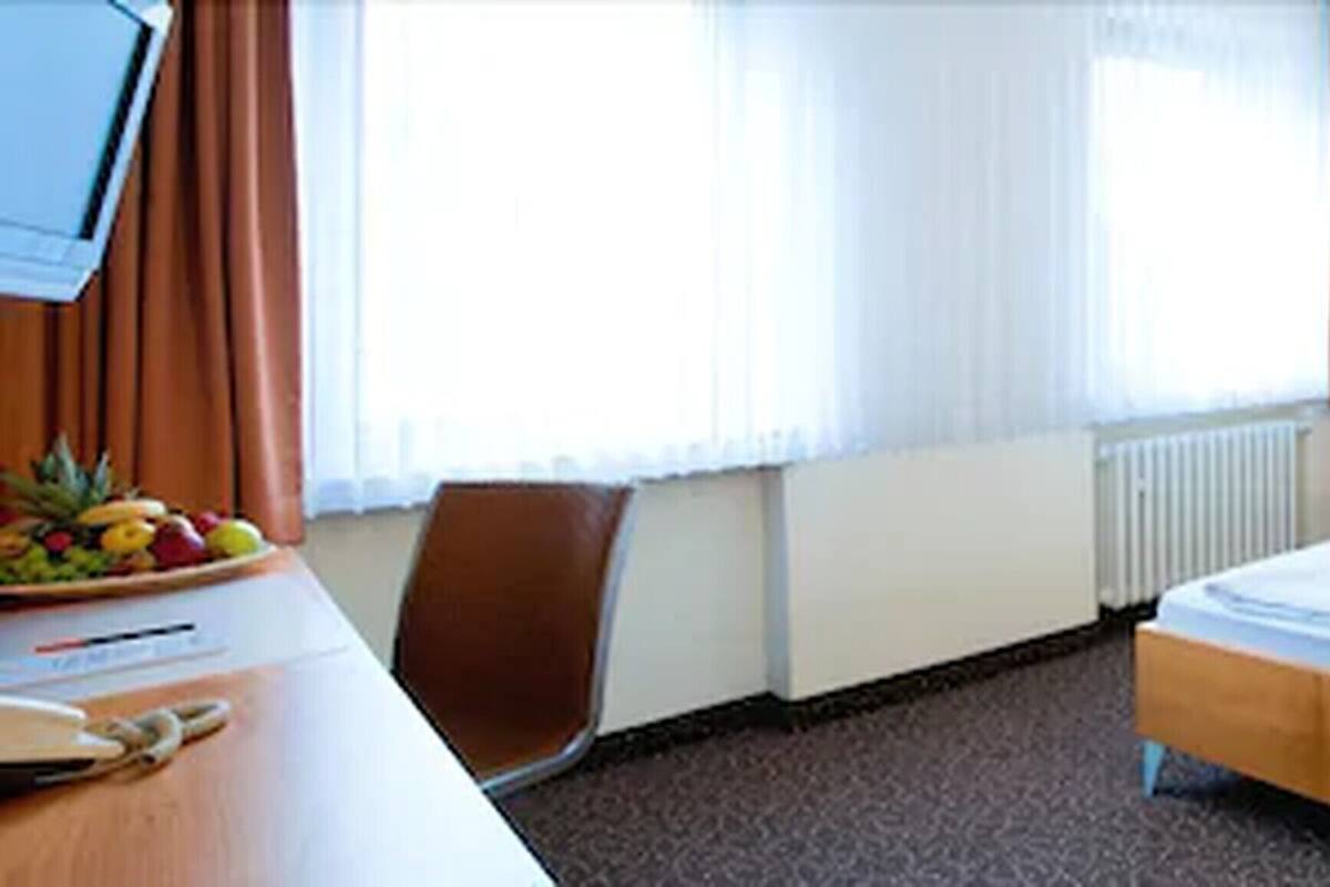 Standard Single Room | Minibar, in-room safe, blackout curtains, iron/ironing board
