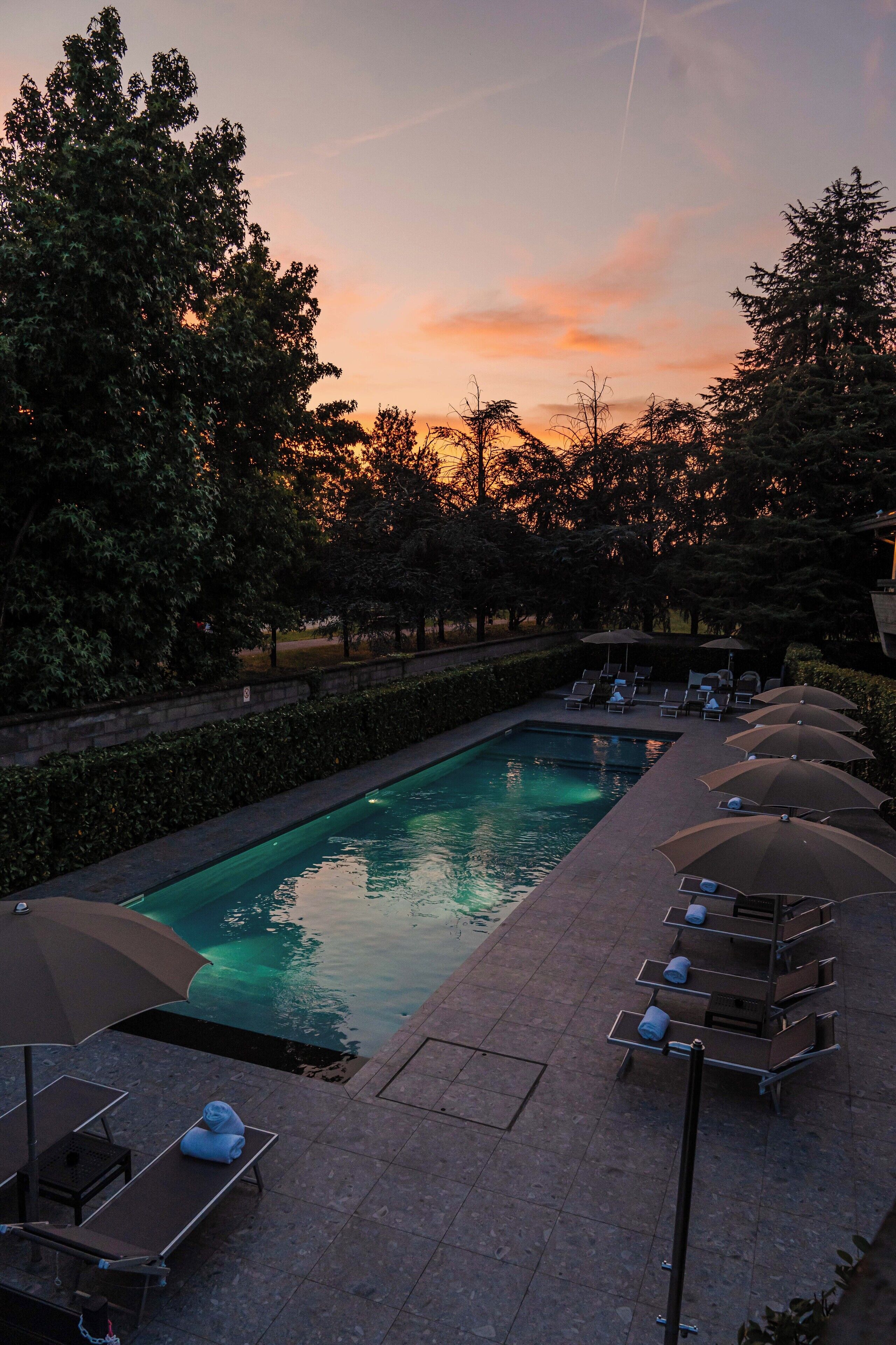 seasonal outdoor pool, open 10:00 am to 8:00 pm, pool umbrellas