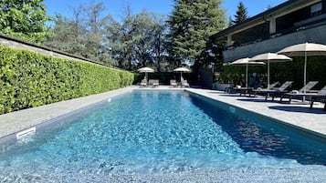 Seasonal outdoor pool, pool umbrellas, pool loungers