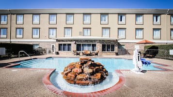 Outdoor pool, open 8 AM to 10 PM, pool loungers