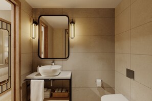 A bathroom with a white sink, a mirror, and two wall-mounted lights. - Alua Linda Mallorca (Palma de Mallorca)