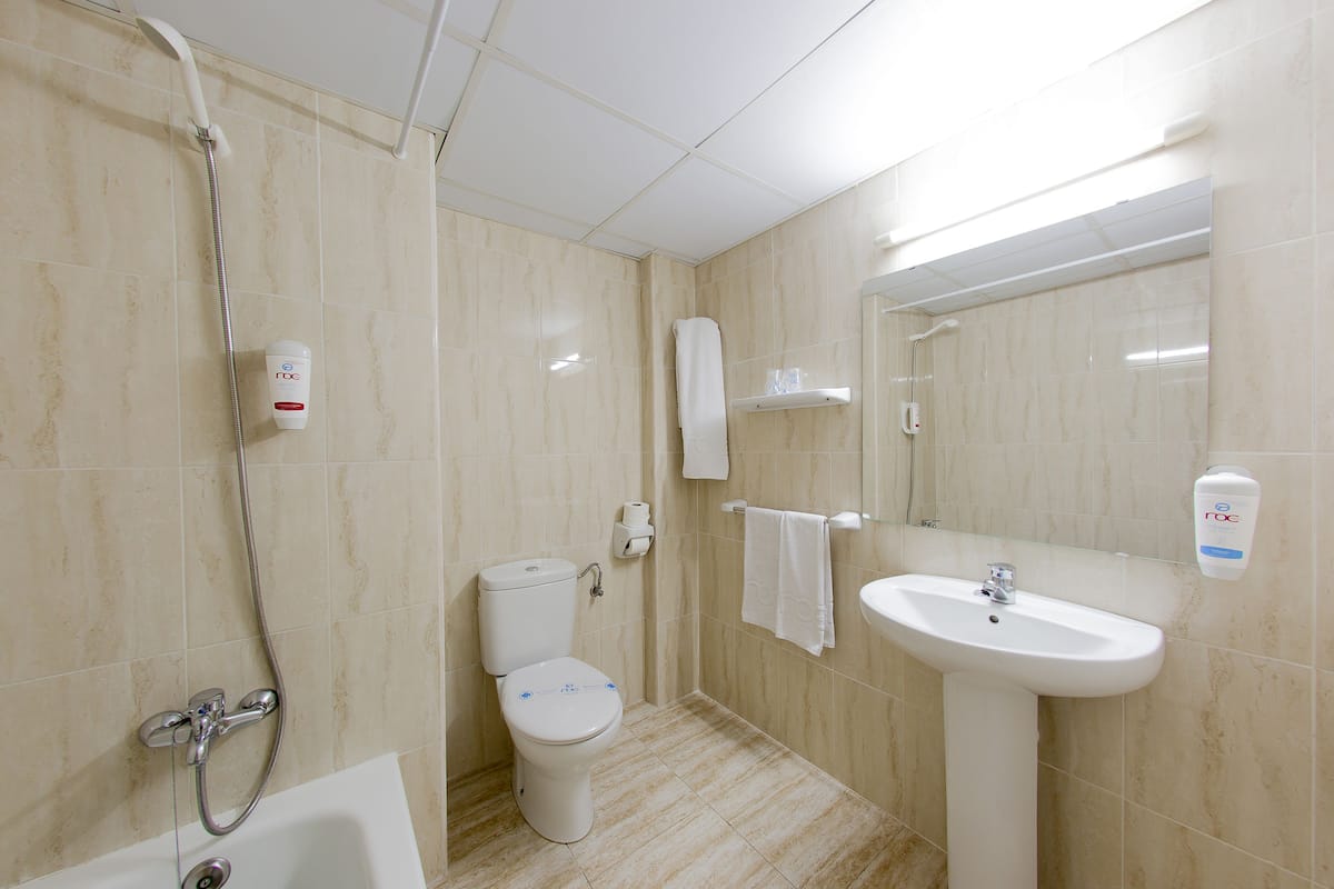 combined shower/bathtub, hair dryer, towels, soap