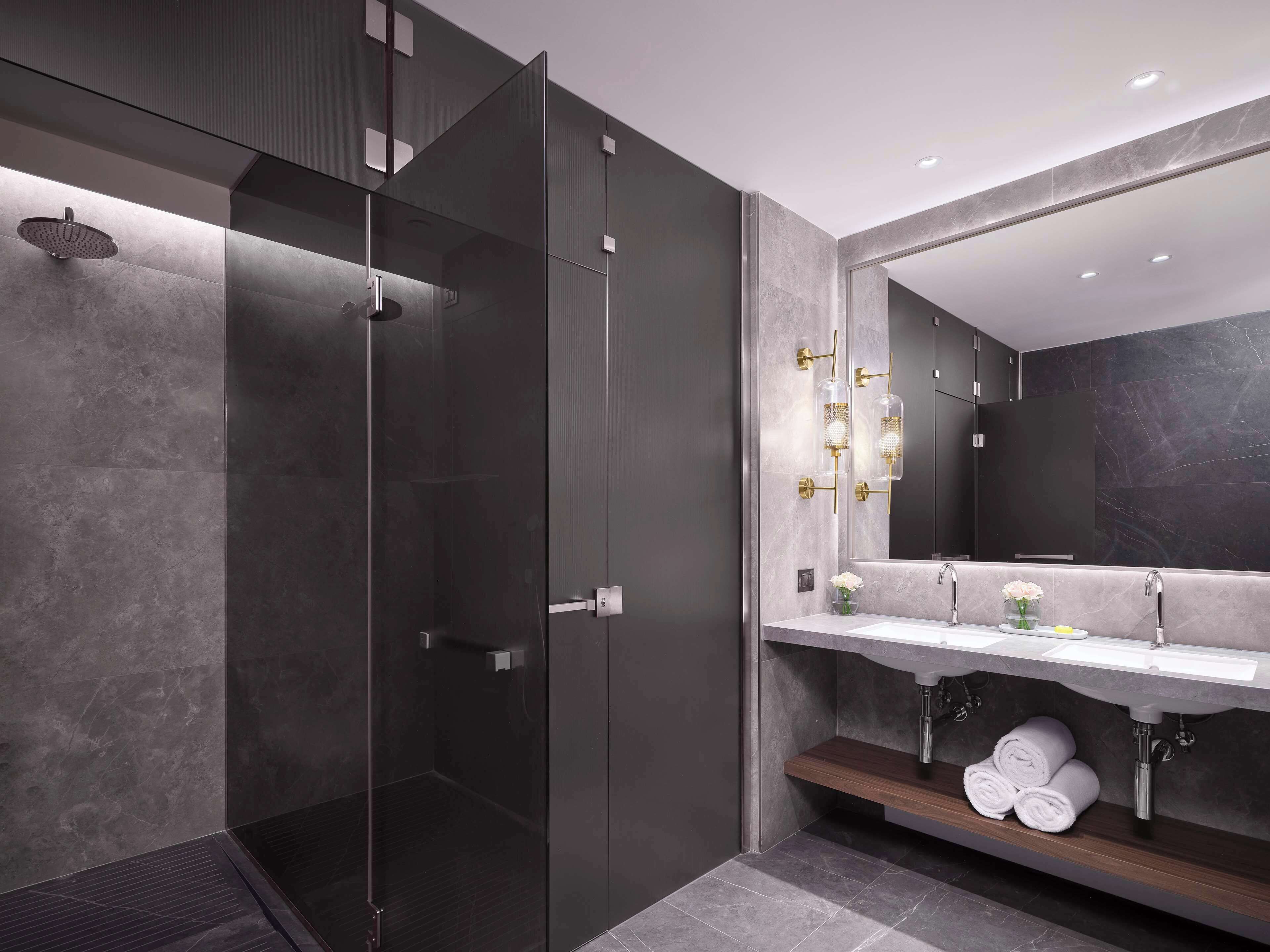 Designer toiletries, hair dryer, slippers, towels