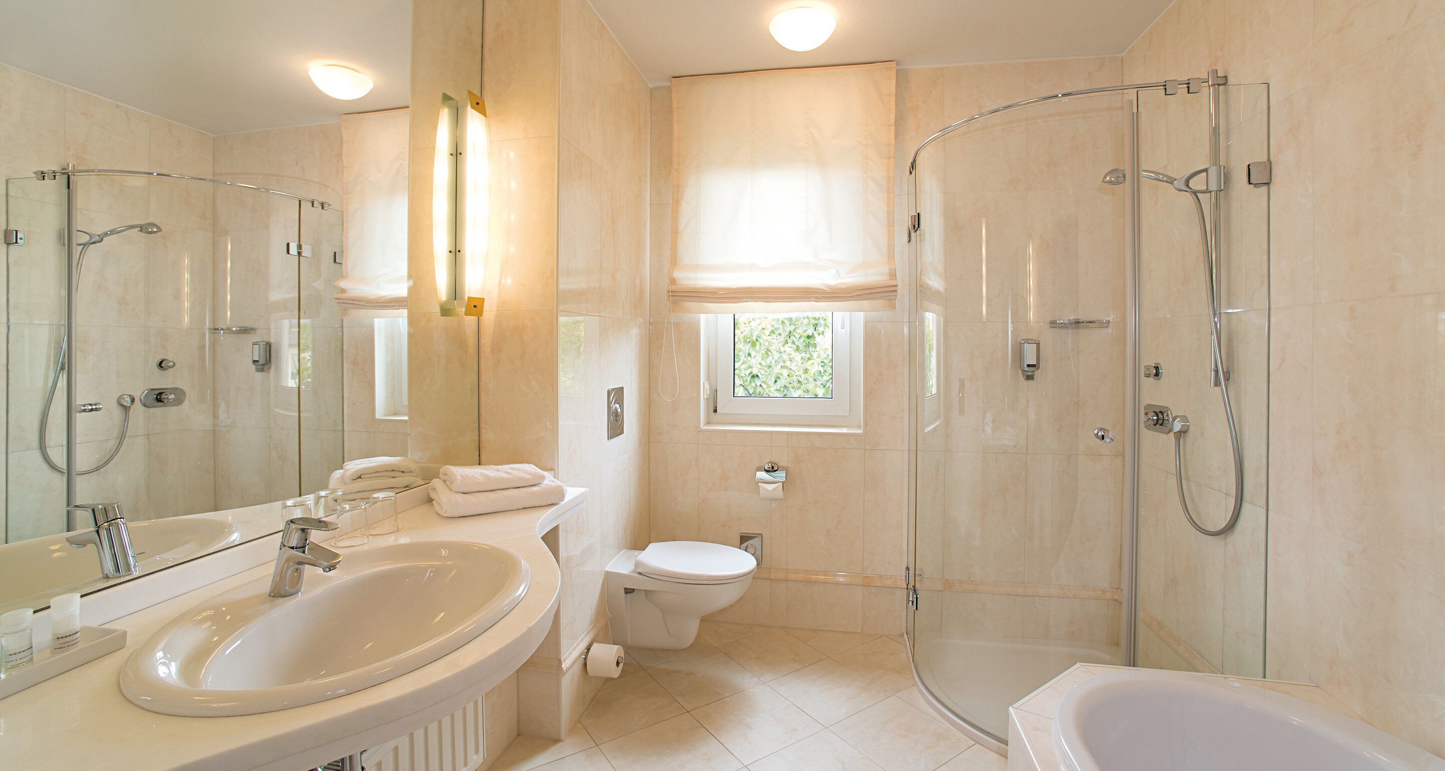 junior suite | bathroom | shower, hair dryer, towels