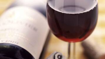 A wine bottle and a wine glass.