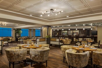 Breakfast, lunch, dinner served; American cuisine  at Magnolia Hotel Houston, A Tribute Portfolio Hotel