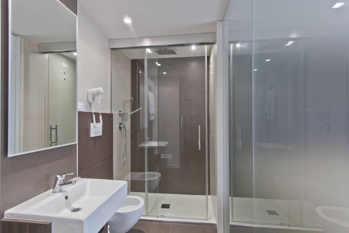 classic quadruple room, private bathroom | bathroom | hair dryer, bidet, towels